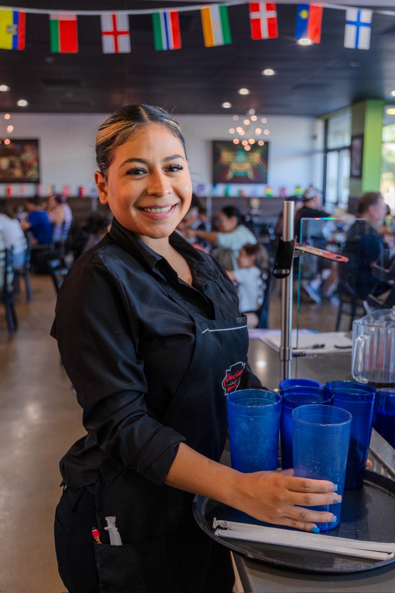 Server bringing drinks to guests
